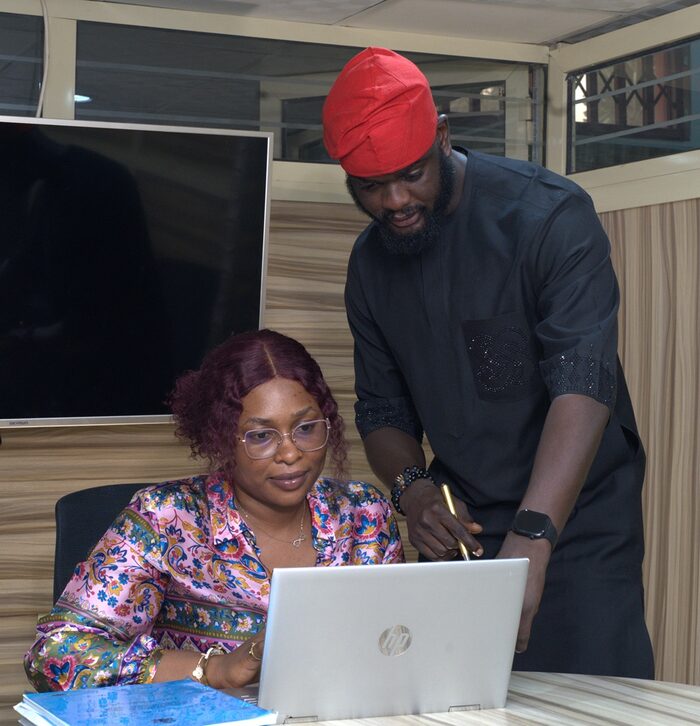 Dozie & Dozie's Pharm leadership team reviewing company records