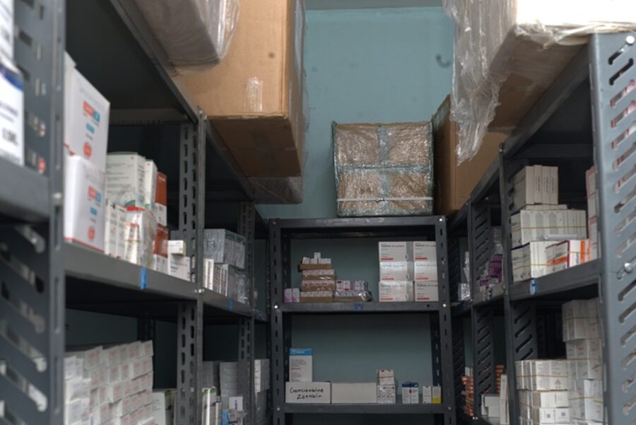 Pharmaceutical warehouse shelving stocked with medicine inventory